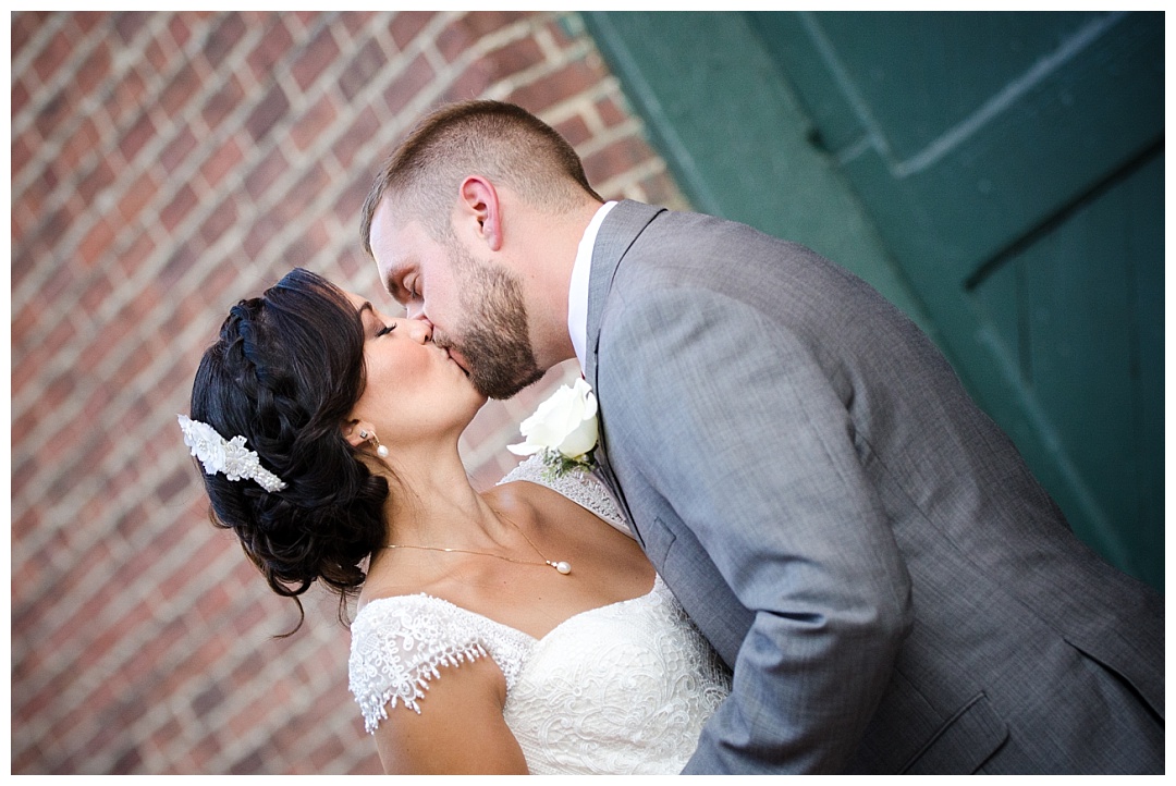 bride and groom kiss