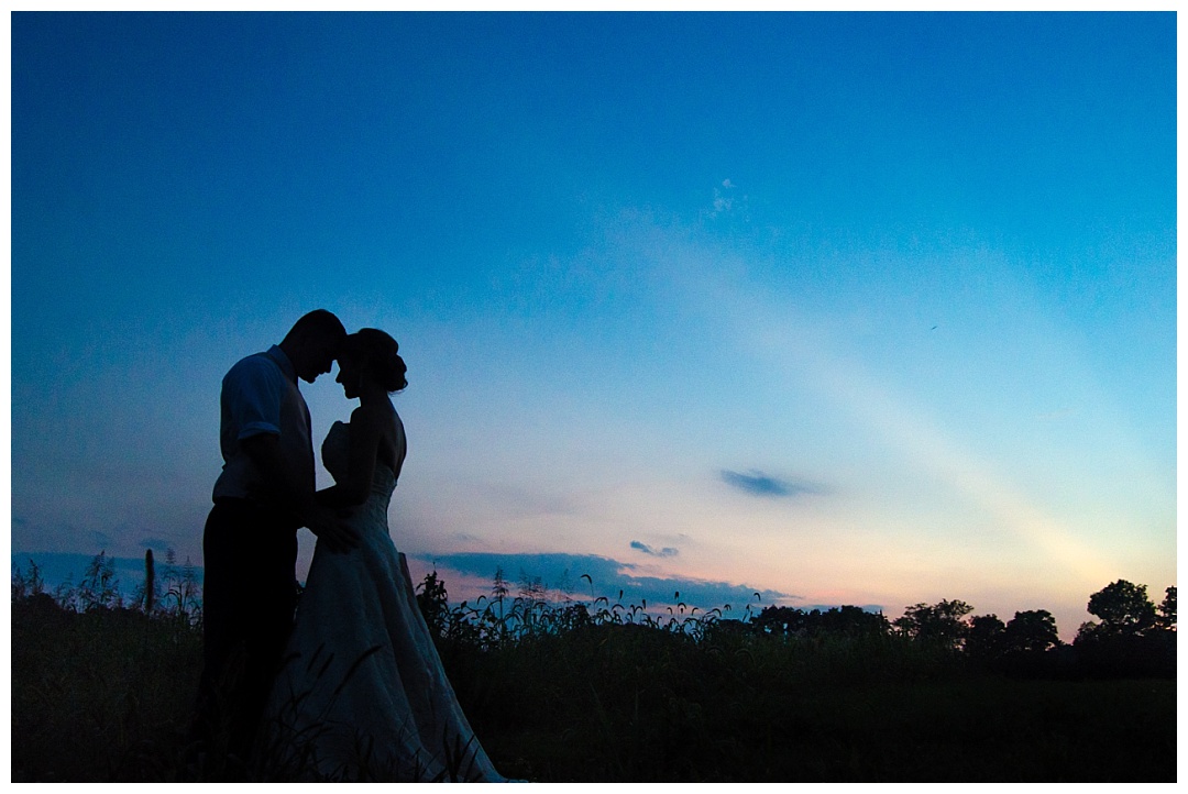bride and groom blue sunset silhouette
